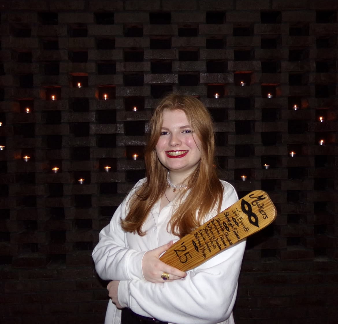 A person holding a skateboard  AI-generated content may be incorrect.